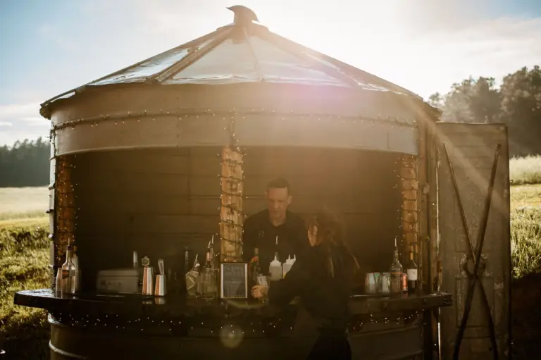 The Grain-Bin-Bar at Younger Ranch: a bartender serving from a converted metal grain bin